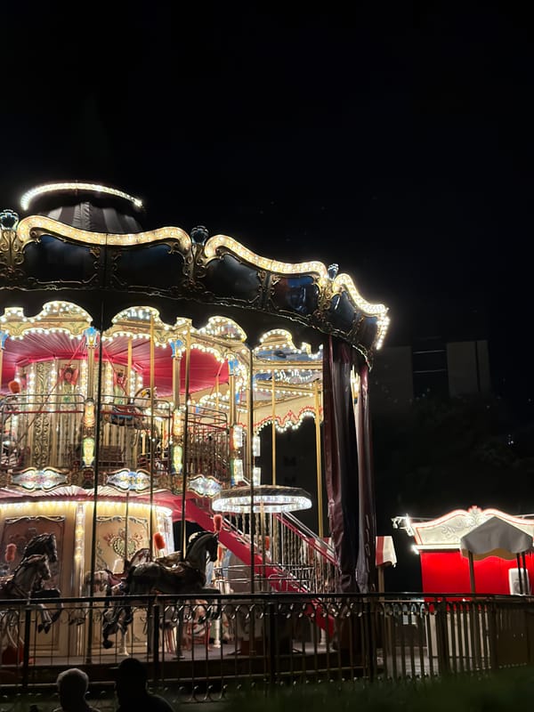 Fairground rides light up a Gdańsk night