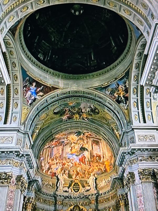 Ornate church ceiling with contrasting domes documented in Tinaquillo