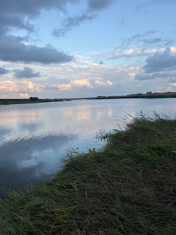 Lakeside fishing session under gathering storm clouds in Tarasivka