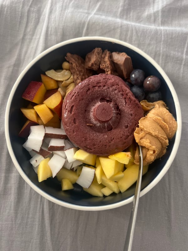 Home cook prepares tropical bowl with fresh coconut