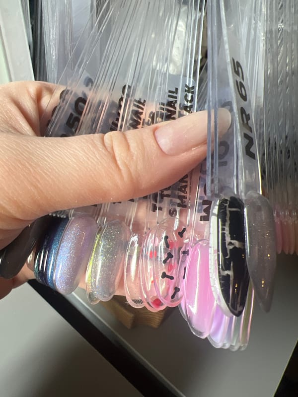 Nail art session documented in Tbilisi with croissant