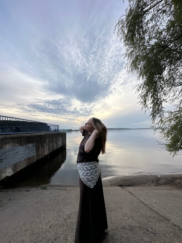 Woman photographed at Kama River waterfront in Chaikovsky, Russia