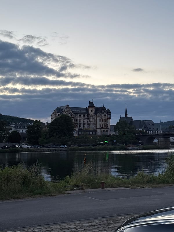 Aerial work and river traffic at Bernkastel-Kues at dusk