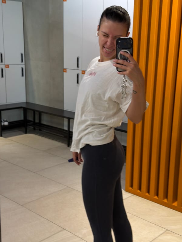 Woman takes mirror selfie in Moscow gym locker room