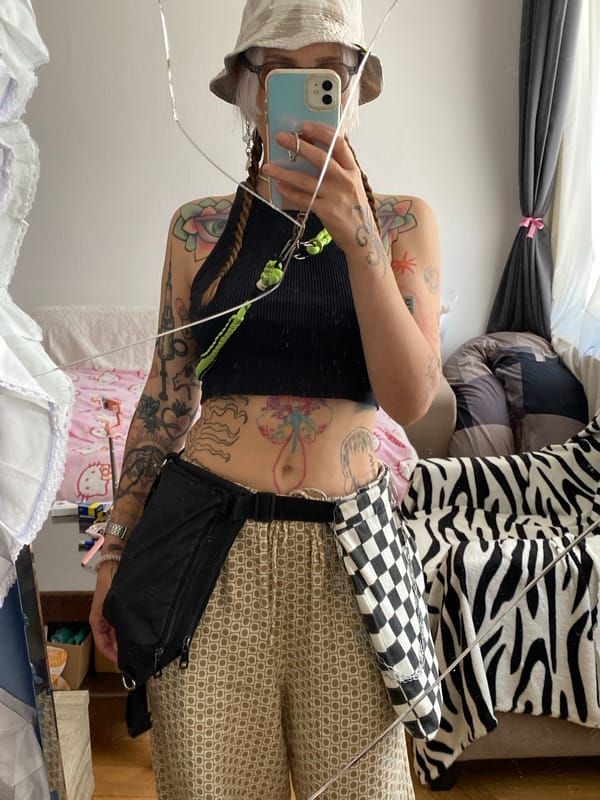 Tbilisi tattoo studio morning: mirror selfies and a scene-stealing cat