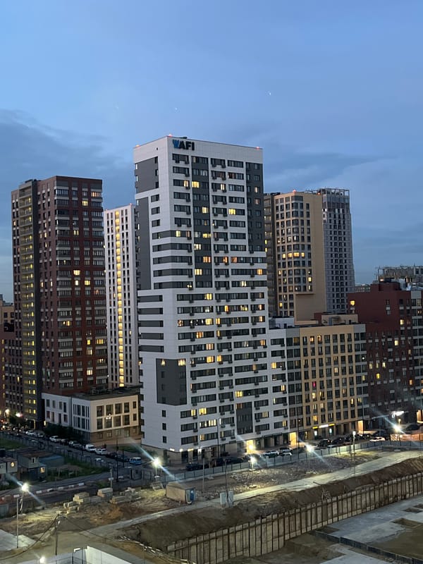 High-rise construction underway at dusk in Tarasovka, Russia