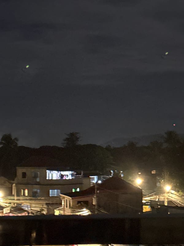 Moonlit night over Davao City's rooftops with a glowing skyline