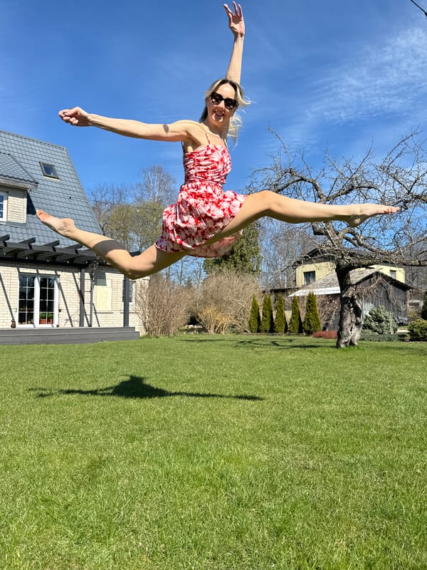 Woman caught mid-jump in joyful moment in Carnikava backyard