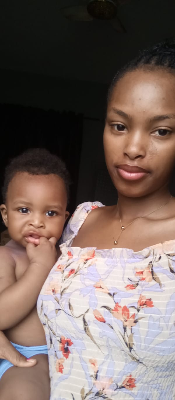 Woman and baby photographed in indoor portraits, Keffi Nigeria