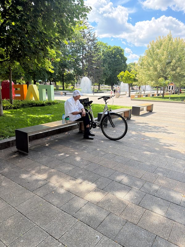 Afternoon in a Pleven park: bench, bike, and fountain