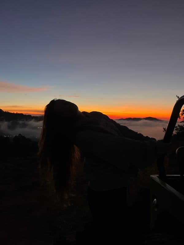 Candid evening moments near a vehicle in Kintamani highlands