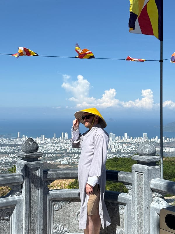 Man in yellow hat overlooks Nha Trang city