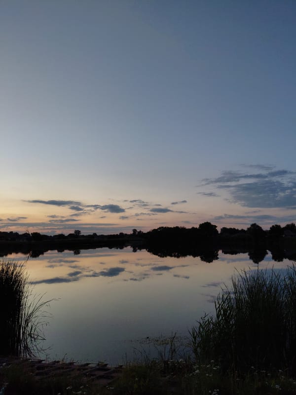 Sunset to dusk across the wetlands and village edges of Ustyvytsia