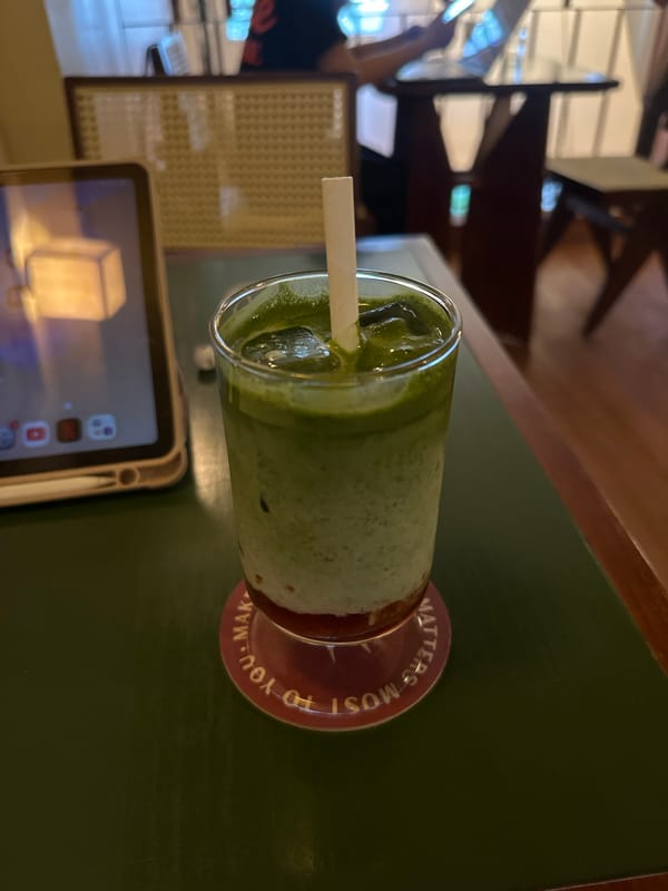 Matcha drink and devices captured at Thủ Đức cafe