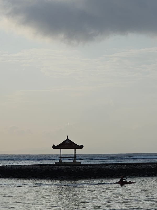 Overcast afternoon on Denpasar's coast, beach life in full swing