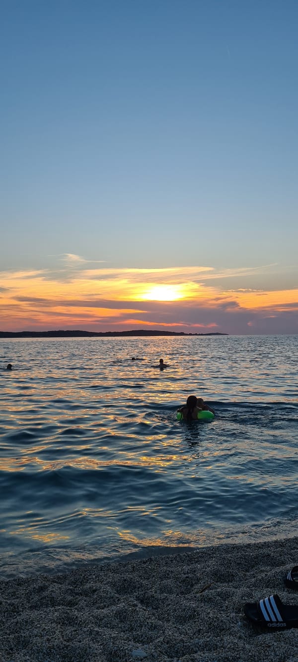 Pebble beach sunset hang in Pula, Croatia