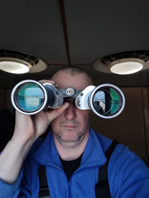 Man with binoculars observed at location 666