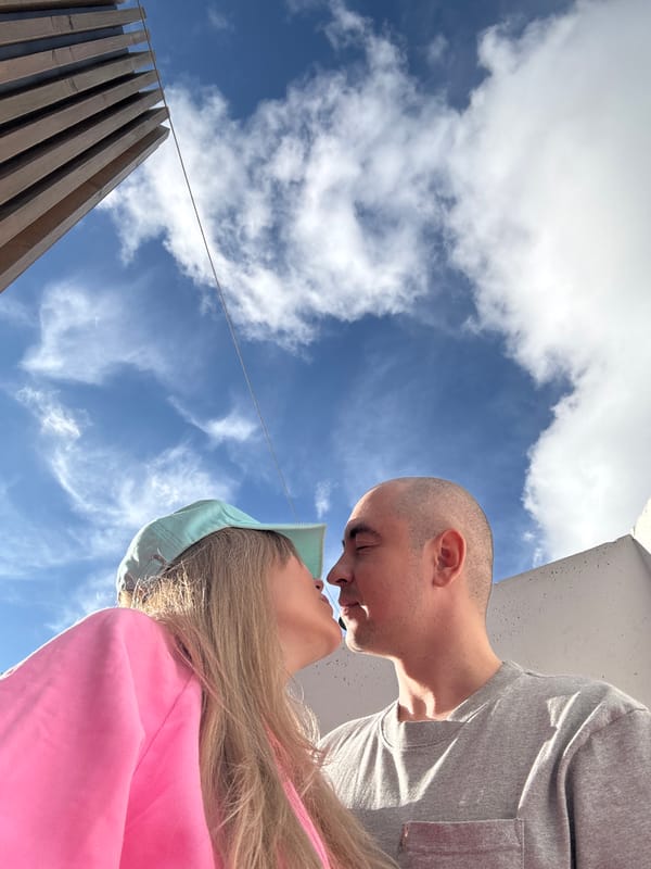 Couple hang out near pink stairs in sunny Yekaterinburg