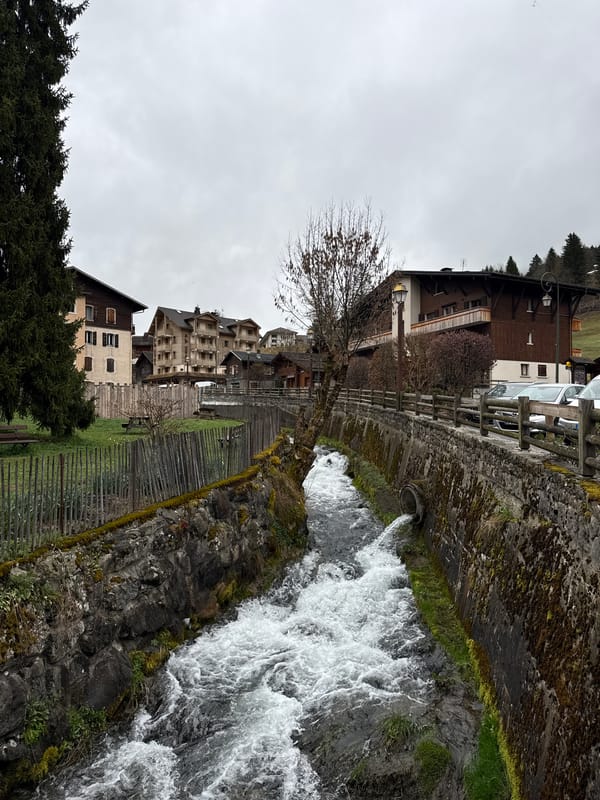 Morning scenes captured in La Clusaz: waterfall and church spire