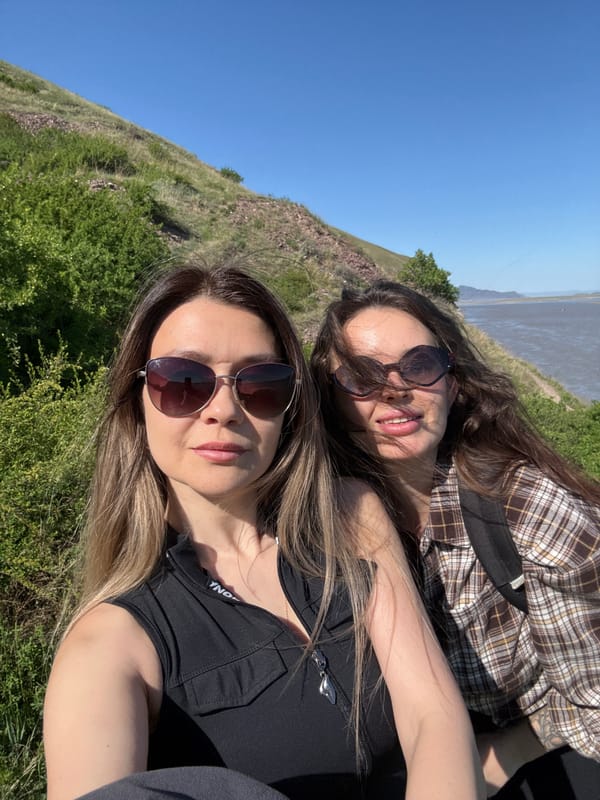 Two women enjoy sunny morning outing in Ust-Abakan countryside