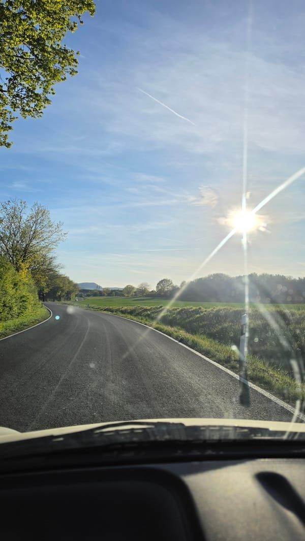 Driver captures sunlit countryside view on German roadway