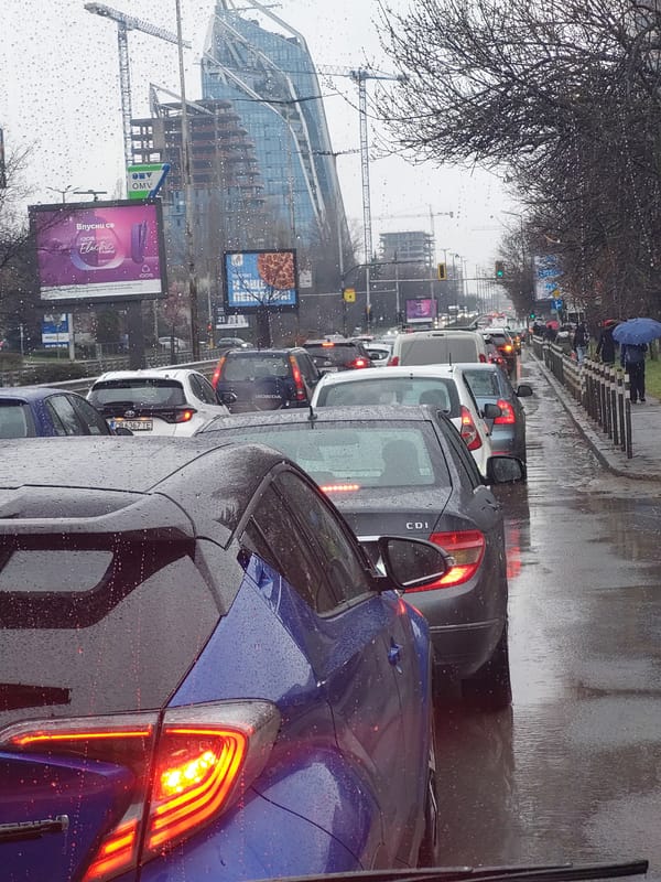 Heavy traffic jams grip wet city streets during rainfall