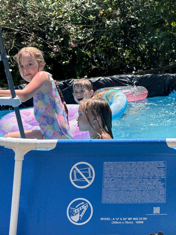 Kids' pool day in a Sochi backyard, summer morning