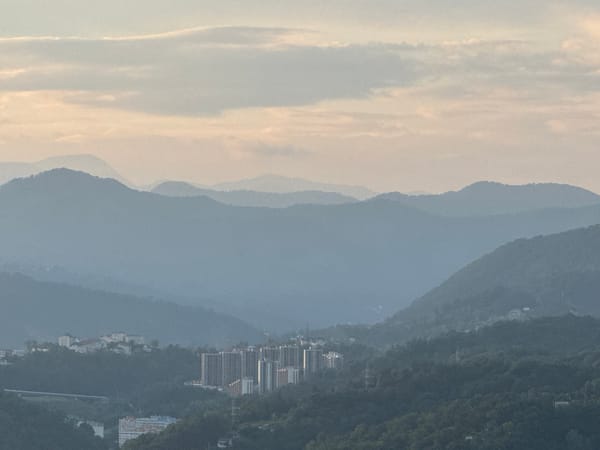 Evening views across Sochi's hillside neighborhoods and valleys