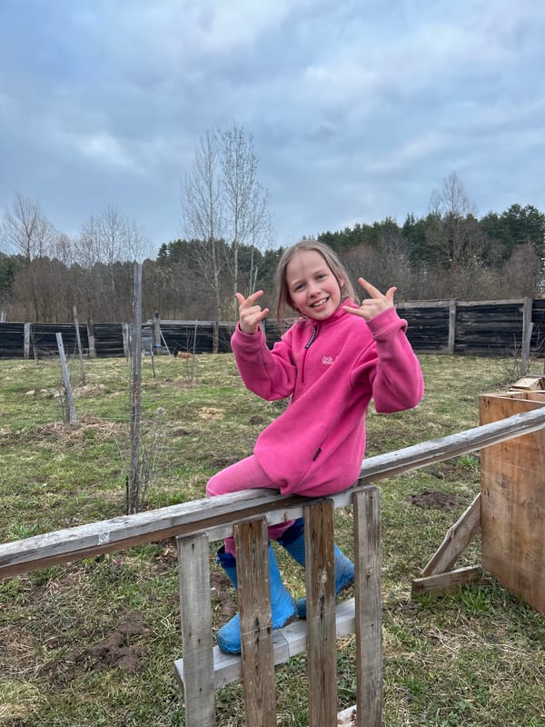 Young girl poses outdoors in Rusalevka, Russia