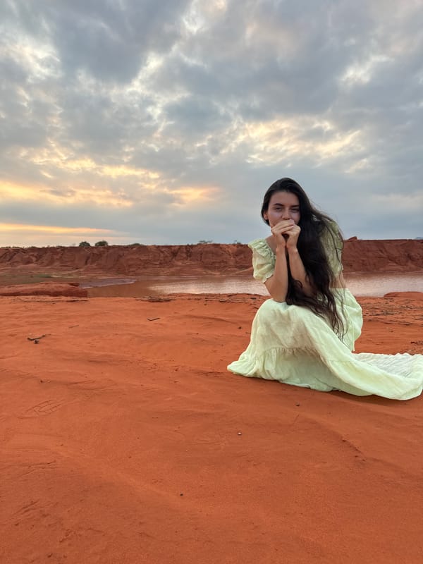 Woman poses for photos at Mui Ne sand dunes