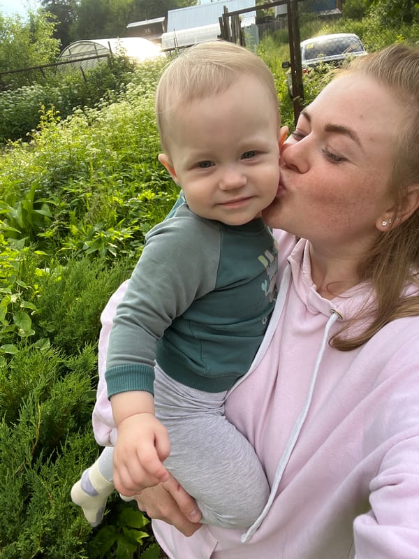 Tender outdoor moment with a baby in Chaikovsky