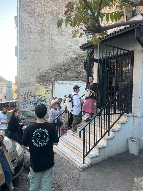 People gather outside building in Belgrade, Serbia