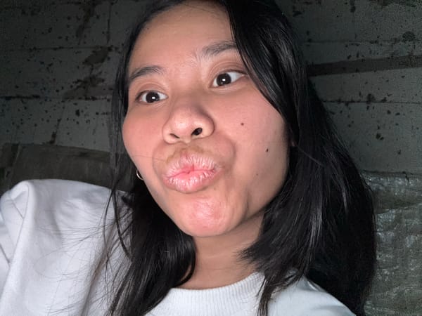 Playful selfie session in East Jakarta bedroom