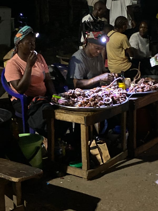 Evening street food gathering draws customers in Bukuru, Nigeria