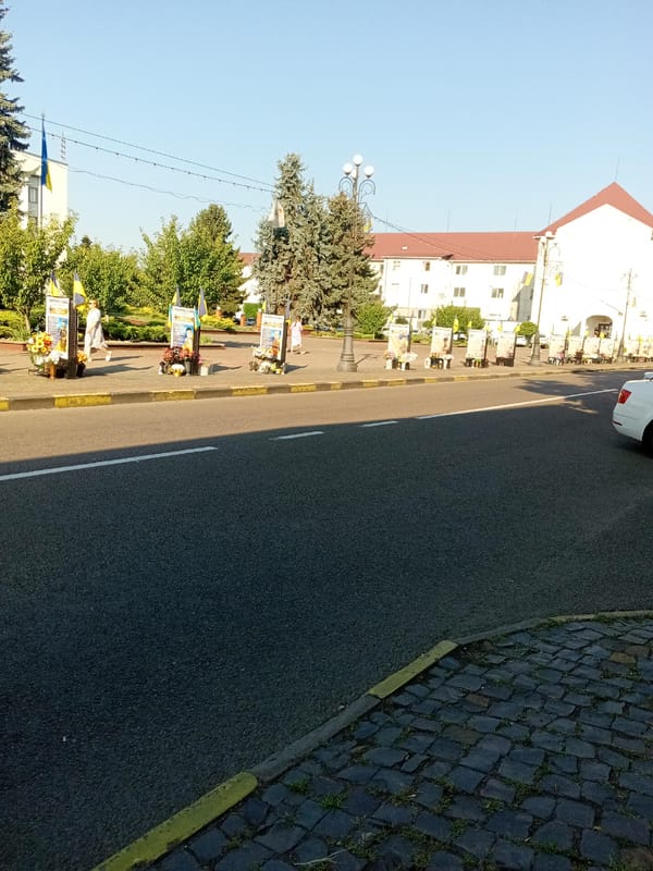 Morning scenes from Tiachiv's town center, memorials and all