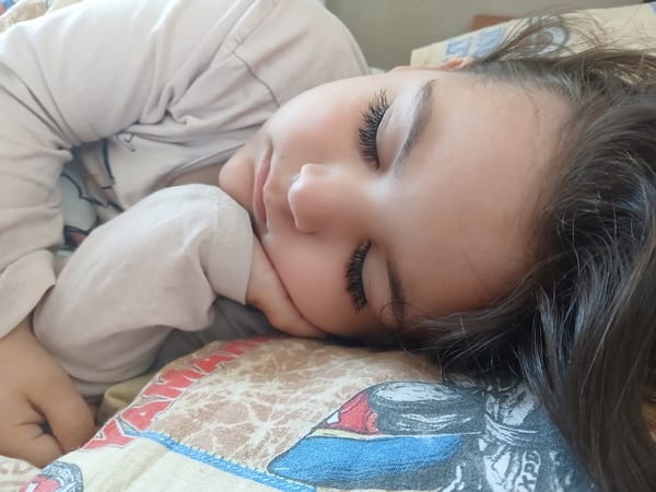 Mother and child rest together in Bulgarian home