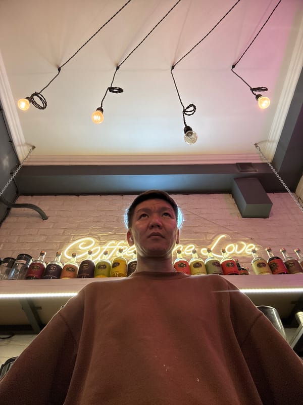 Selfies at a cozy Moscow café with neon signage