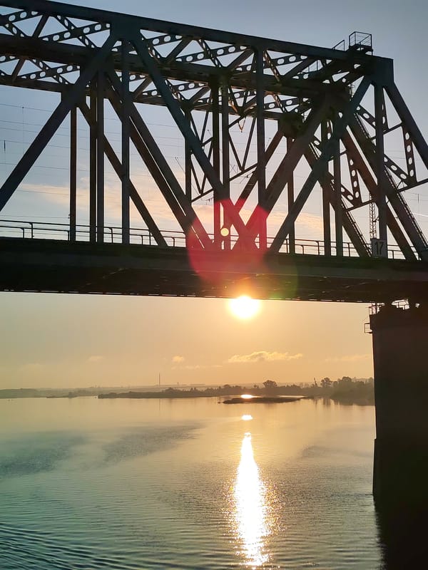 Steel bridge observed at sunset near Tarkanovo, Russia