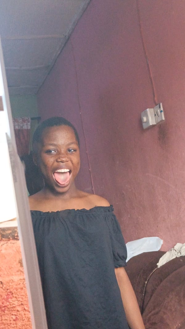 Woman displays playful expression in doorway