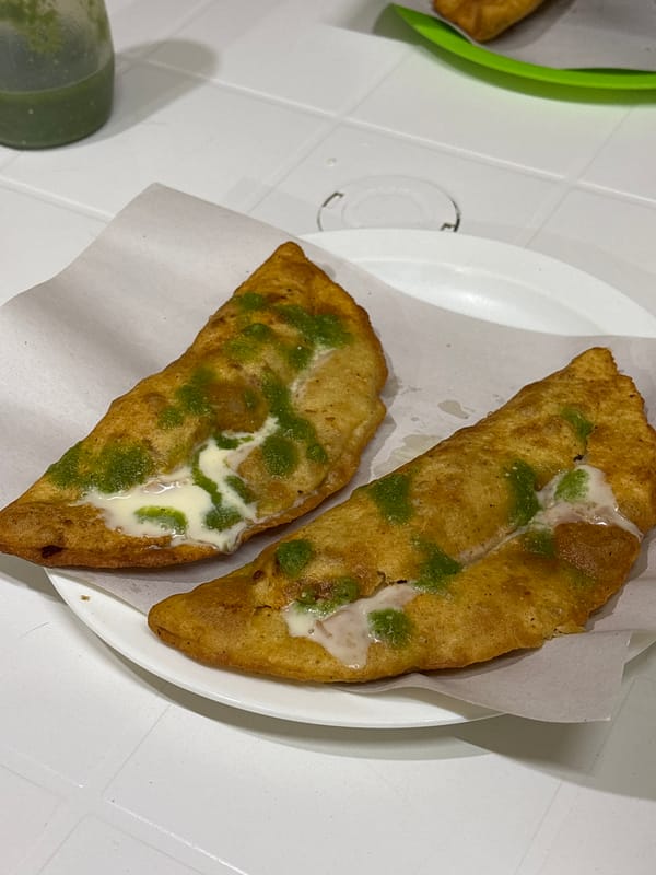 Empanadas with green salsa served in Tlaxcalancingo, Mexico