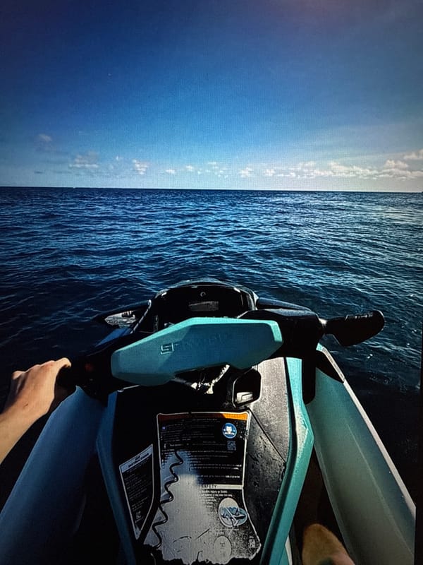 Jet skier enjoys clear day near rocky island in Poland