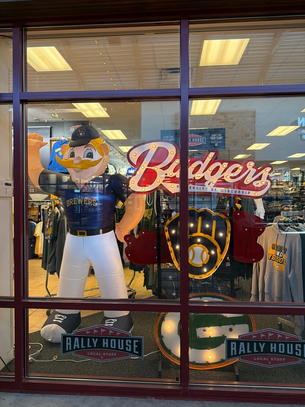 Sports retailer window display documented in Baraboo mall