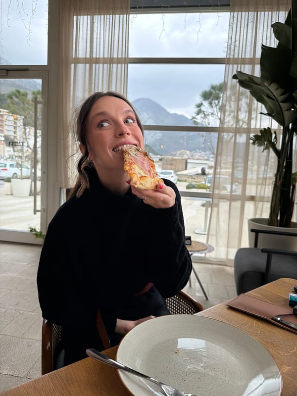 Woman shares seaside lunch with dog in stormy Montenegro