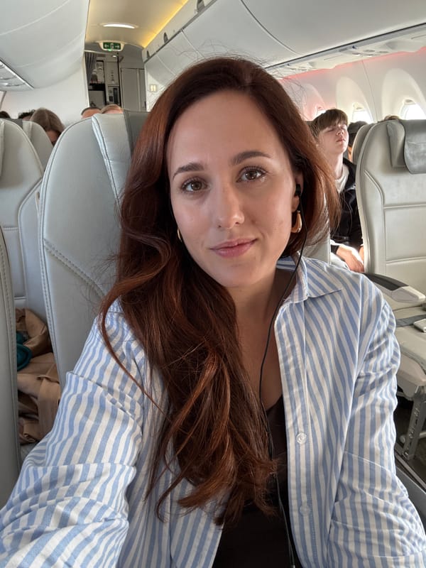 Woman with headphones travels on commercial flight