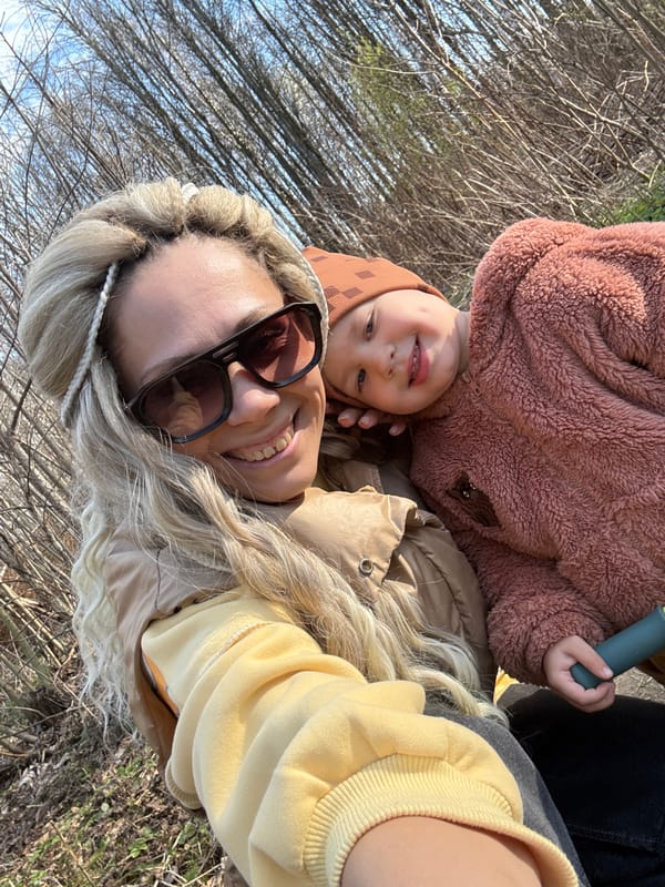 Woman and child enjoy outdoor time in Rusanovo forest