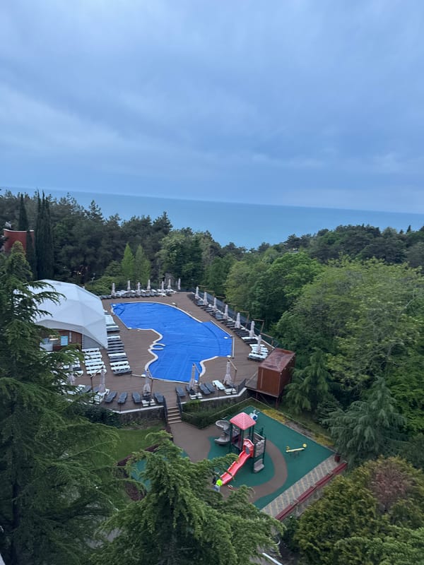 Resort pool and playground facility documented in Sosnovy, Russia