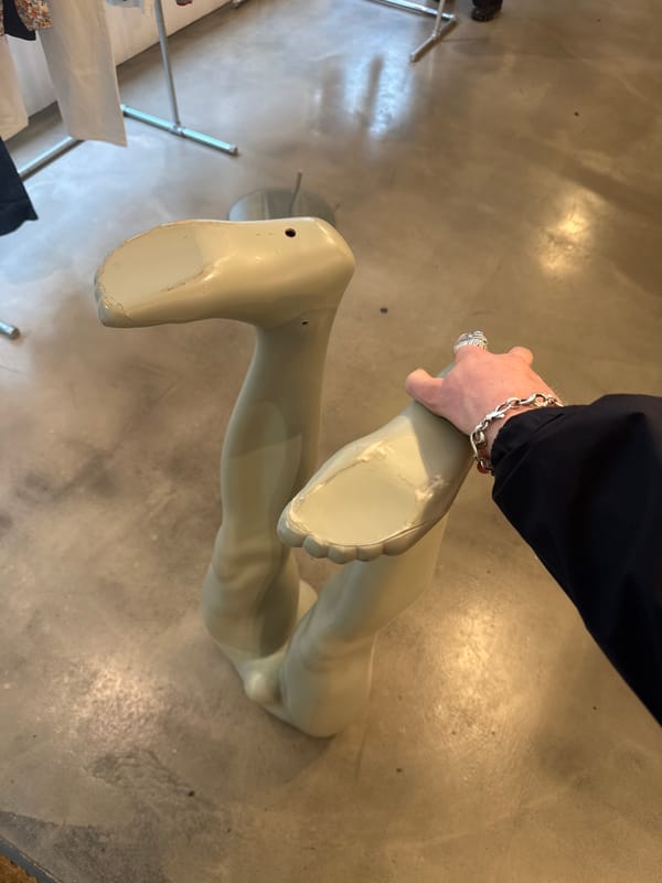 Person handles mannequin parts in London location