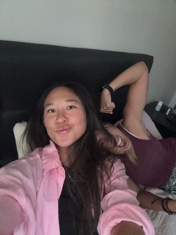 Two women rest on couch in Miraflores