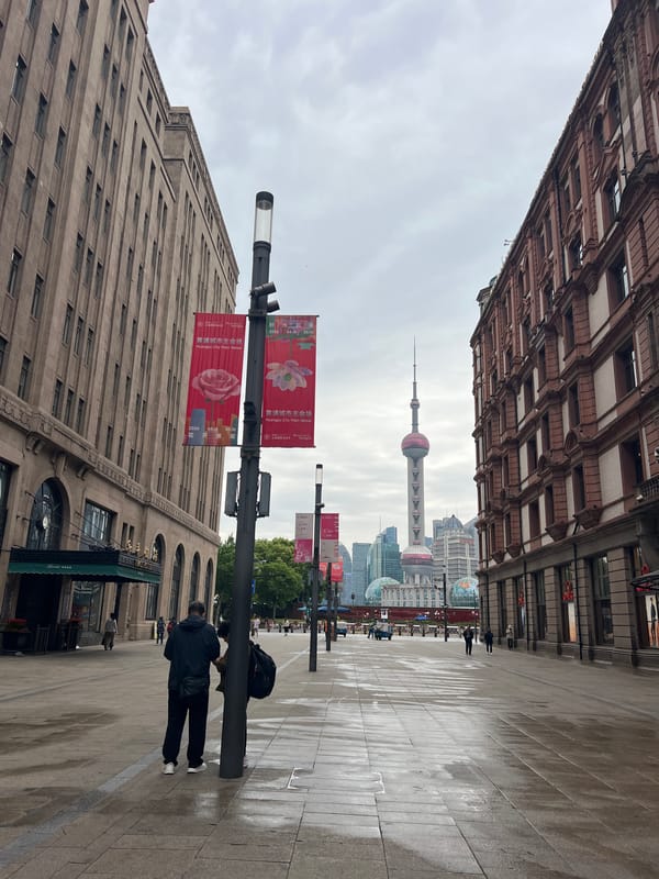 Shanghai street views feature Oriental Pearl Tower, flags