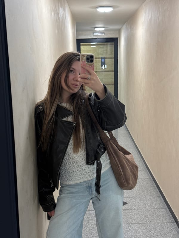 Woman Takes Mirror Selfie in Belgrade Public Space